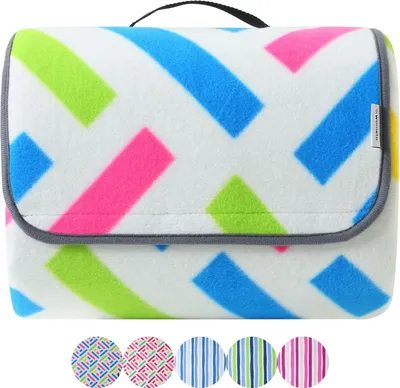 A folded picnic blanket with a colorful geometric pattern.