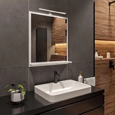 A modern bathroom vanity with a sink, faucet, and mirror.