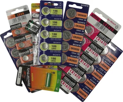 A collection of various types of button cell batteries and battery packs.