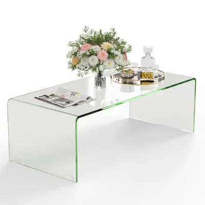 A clear, studio shot of a U-shaped glass coffee table.