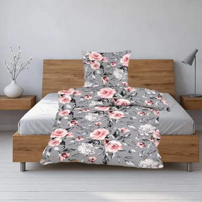 A floral patterned duvet cover and pillowcase set on a bed.