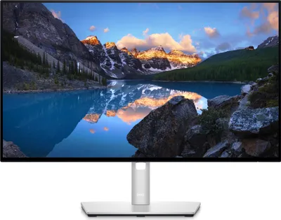 A computer monitor displaying a scenic landscape.