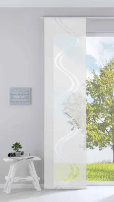 A modern panel curtain with a wave pattern is shown in a room setting, partially covering a window with a view of a tree and grass.