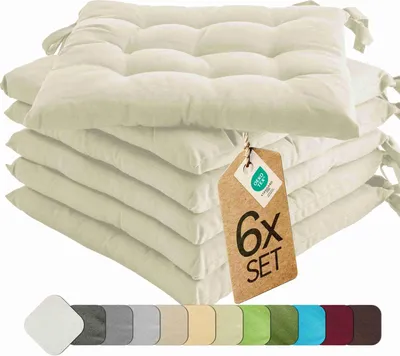 A stack of cream-colored seat cushions with ties, a tag indicating a set of 6, and a row of color swatches at the bottom.