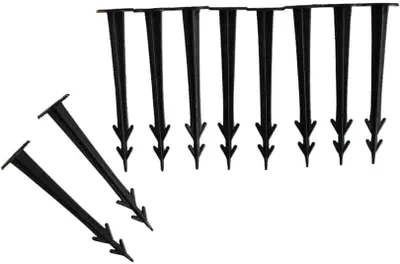 A group of black plastic ground stakes arranged on a white background.