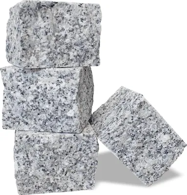 Four granite paving stones stacked and arranged.