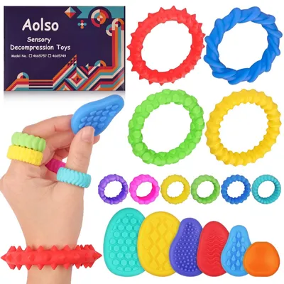 Produktbild von Fidget-Spielzeug – Set mit 4 Armbändern, 6 sensorischen Steinen und 6 Ringen – aus Silikon