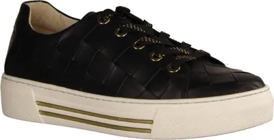 A black leather sneaker with a woven pattern and a white platform sole with gold accents.