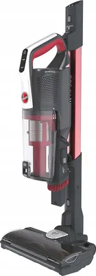 A cordless stick vacuum cleaner on its charging base.