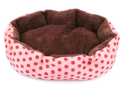 A pink and red polka dot pet bed with a brown plush interior, shown from a slightly elevated front-facing angle on a white background.