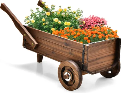 A wooden wagon filled with colorful flowers on a white background.