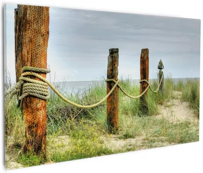 Produktbild von Wallario Premium Leinwandbild Düne am Strand mit Holzpfahl in Größe 60 x 90 cm