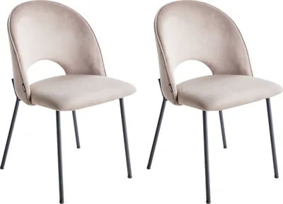 Two taupe velvet dining chairs with black metal legs are shown against a white background.