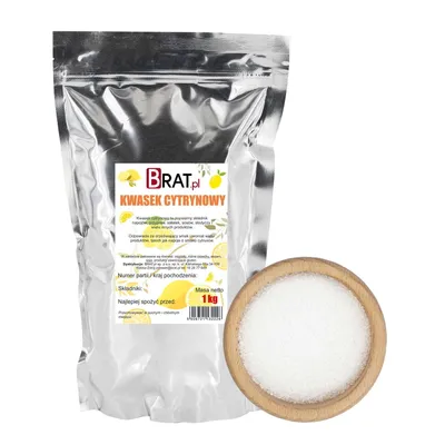 A silver pouch of citric acid next to a wooden bowl filled with the product.