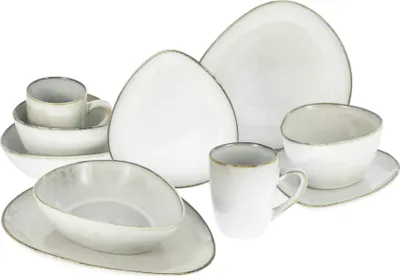 A collection of white ceramic tableware, including plates, bowls, and mugs, arranged on a white background.