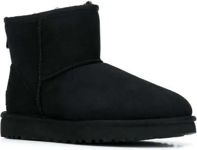 A black UGG boot is shown against a white background.