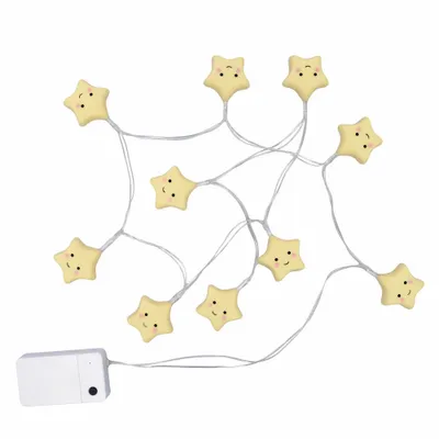 A string of star-shaped lights with faces, connected to a battery pack.