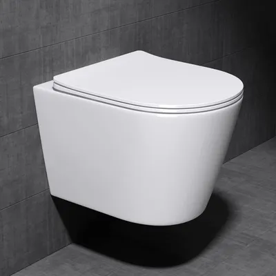 A white wall-mounted toilet is shown against a dark gray tiled wall and floor.