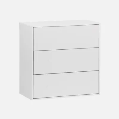 A white three-drawer chest of drawers on a light gray background.