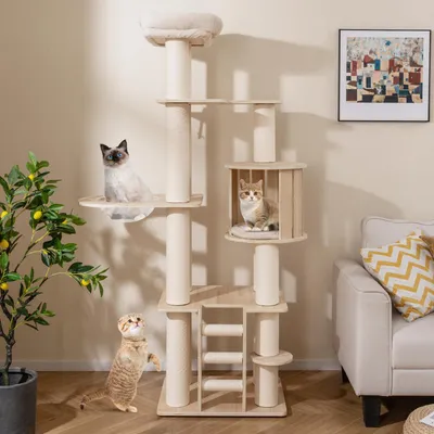 A multi-level cat tree with two cats on it, placed in a living room setting next to a sofa and a plant.