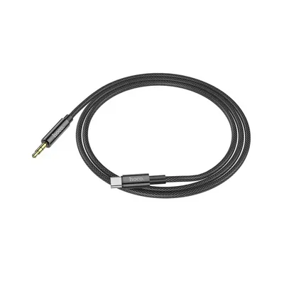 A black audio cable with a 3.5mm jack on one end and a USB Type-C connector on the other, laid out in a loop on a white background.