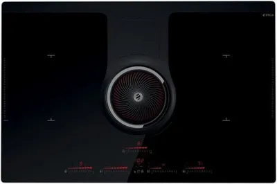 A top-down view of a black induction cooktop with an integrated ventilation system.