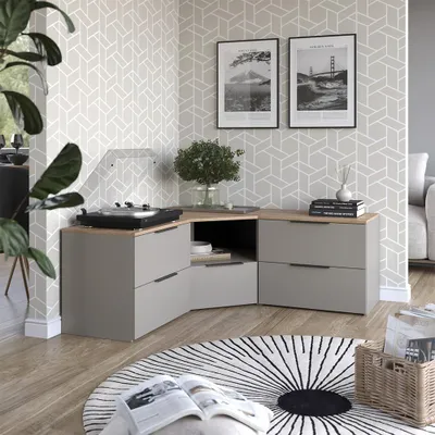 A modern living room corner with a media console, turntable, and decorative items.