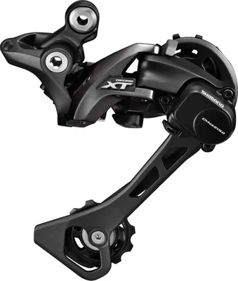 A close-up studio shot of a bicycle rear derailleur.