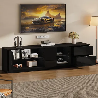 Zdjęcie produktu dla Szafka RTV o wymiarach 160x40x52 cm, przeznaczona do telewizorów o przekątnej 65 cali, czarna, wykonana z MDF z frontem w wysokim połysku i oświetleniem LED
