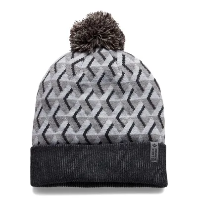 Grau-weiße Mütze mit Zickzackmuster und Bommel von Black Diamond.