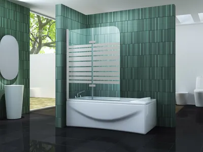 A modern bathroom with a bathtub, shower screen, sink, and toilet, featuring green tiled walls and black tiled floors.