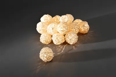 A string of decorative LED lights shaped like woven balls.