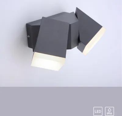 A modern, geometric LED outdoor wall lamp mounted on a white wall.