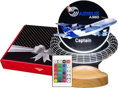 A gift set featuring an LED lamp with an Airbus A380 airplane design, a remote control, and a gift box.