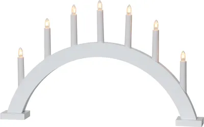 A white arched candle bridge light with seven electric candles.