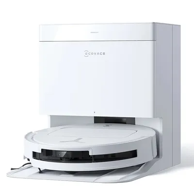 A white robot vacuum cleaner with its charging and emptying station.