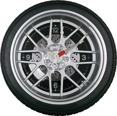 A clock designed to look like a car wheel with a tire and brake disc.