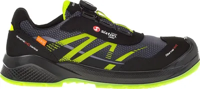 A side view of a black and neon green safety shoe.