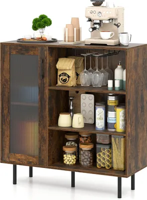 A wooden sideboard with a glass door, filled with various items like coffee machine, wine glasses, jars, and pasta.