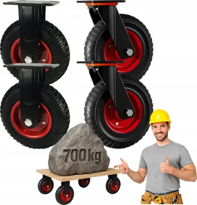 A man in a yellow hard hat is giving a thumbs up next to a demonstration of heavy-duty casters supporting a large rock.