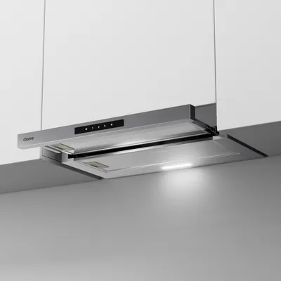A modern kitchen environment with a stainless steel range hood installed under white cabinets.