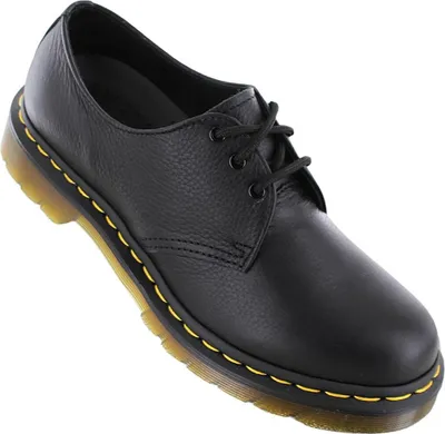 A black leather Dr. Martens shoe is shown against a white background.