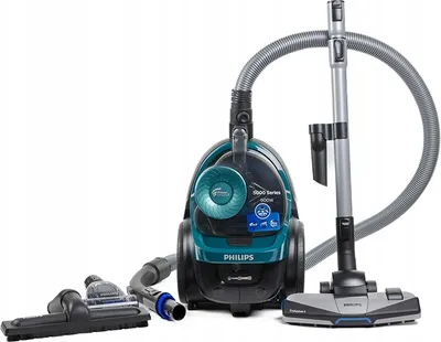 A teal and black Philips vacuum cleaner with its accessories, including the hose, wand, and floor head, is displayed against a white background.