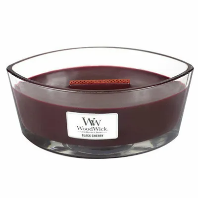 A WoodWick Black Cherry scented candle in a clear glass bowl.
