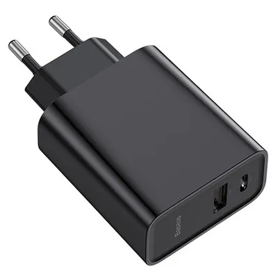 A black USB charger with two ports and foldable prongs.