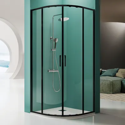 A modern shower enclosure with a black frame and glass doors, featuring a shower head and handheld shower.
