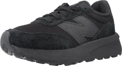 A black New Balance sneaker is shown from the side against a white background.