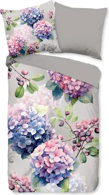 A flat lay of a duvet cover and pillow with a floral hydrangea pattern.