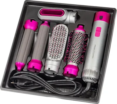 A hair styling kit with multiple attachments laid out in a black organizer tray.