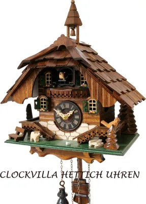 A detailed view of a traditional wooden cuckoo clock.